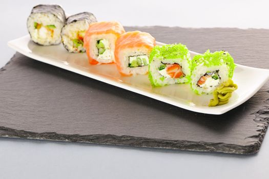 Sushi rolls on a slate plate