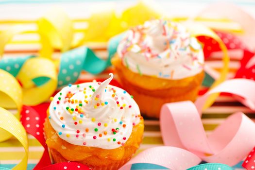 Cupcakes with whipped cream and icing