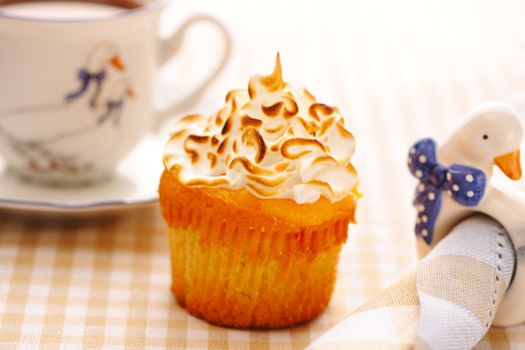 Cupcake with whipped cream and icing