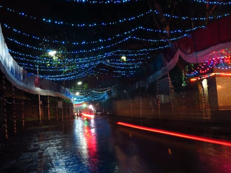 An Indian street and temple decorated with beautiful lights on the occassion of Dassera festival.