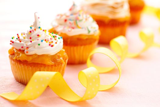Cupcakes with whipped cream and icing