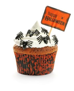 Halloween cupcake with whipped cream and decoration isolated on white