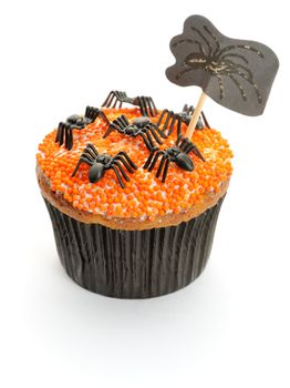 Halloween cupcake with decoration isolated on white