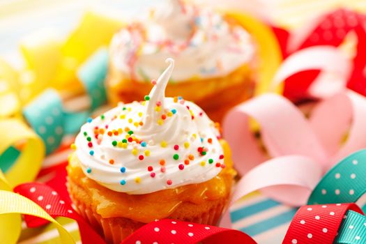 Cupcakes with whipped cream and icing