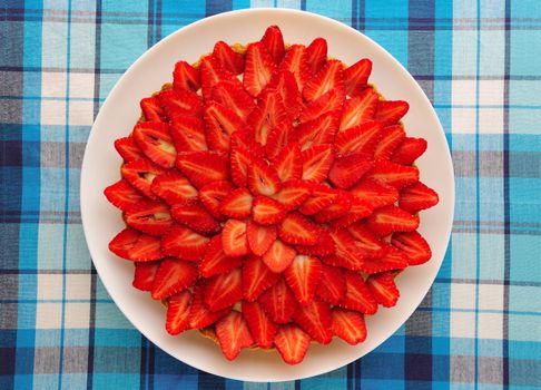 Homemade strawberry tart on table