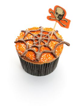 Halloween cupcake with decoration isolated on white