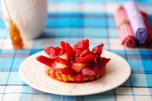 Homemade strawberry tart on table
