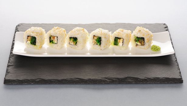 Sushi rolls on a slate plate