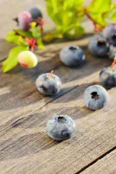 Blueberry with leafs on wooden table