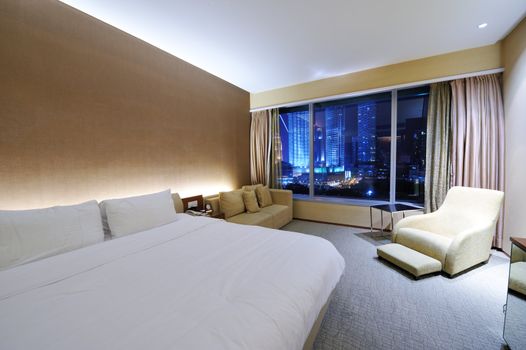 Luxurious hotel room interior with large window