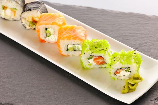 Sushi rolls on a slate plate