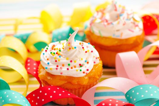 Cupcakes with whipped cream and icing