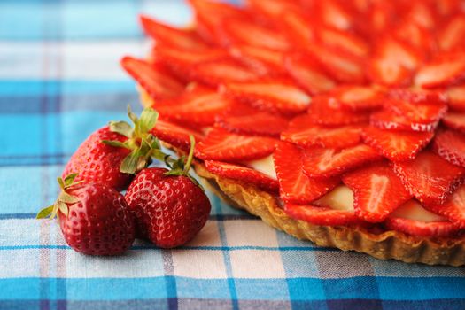 Homemade strawberry tart on table