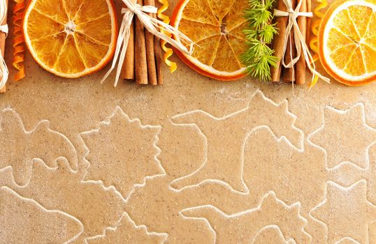 Christmas spices over homemade gingerbread dough