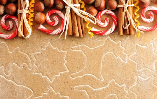 Christmas spices over homemade gingerbread dough