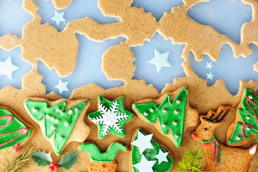 Christmas homemade gingerbread cookies over dough