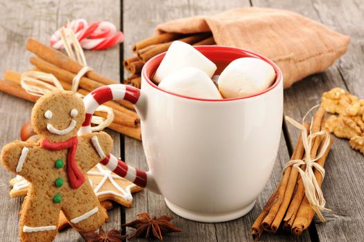Mug of hot chocolate on wooden table
