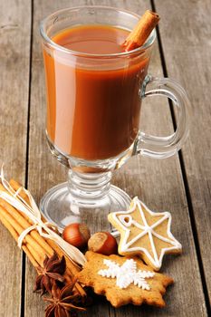 Glass of hot chocolate on wooden table