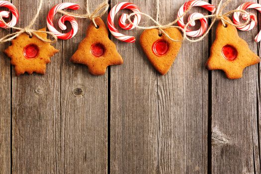 Christmas homemade gingerbread cookies over wooden table