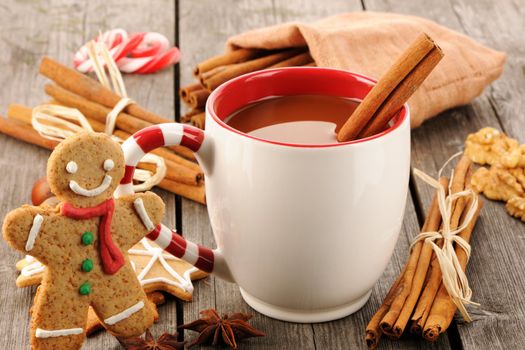 Mug of hot chocolate on wooden table