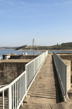 Footbridge accessing the penstocks of the overflow spillway in Vigia dam supplying drinking water to the county of Redondo, Alentejo, Portugal