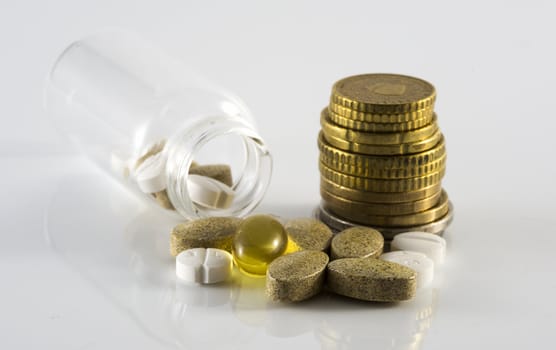 euro coins and medicine pills