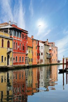 Chioggia Venice, typical houses along the canal with reflections