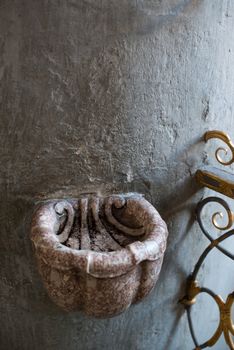 Stone stoup providing holy water in catholic church