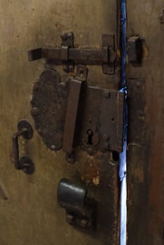 big old lock on massive wooden door