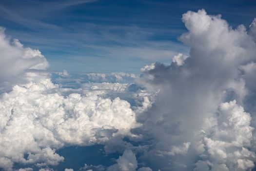 Aerial view on white fluffy clouds