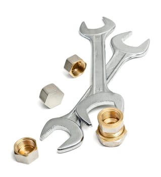 Spanners and spare parts on a white background