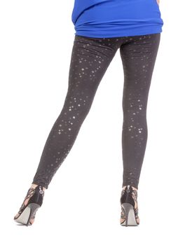 Cropped view image of a woman's sexy legs clad in shimmering black leggins and stilettos