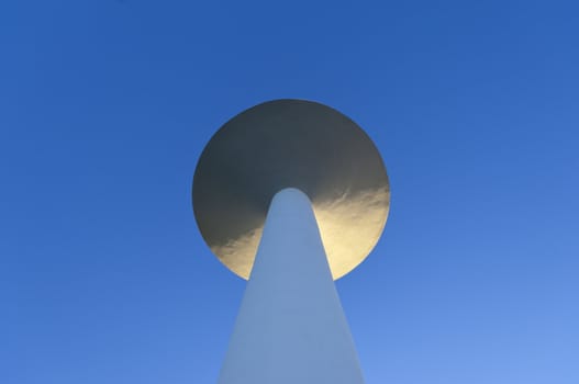 White painted water tower against a clear blue sky in the small village of S. Bartolomeu do Outeiro,  Alentejo, Portugal