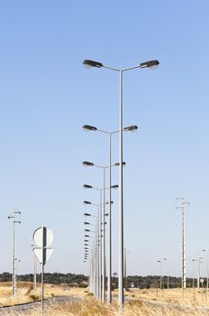 Street lights in fully infra-structured vacant lots ready for construction in the industrial park of Evora, Portugal