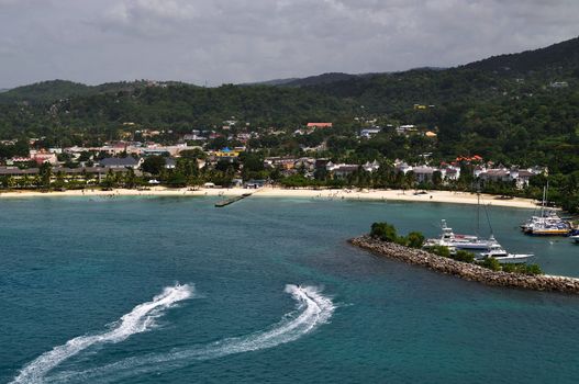 Two tourists enjoy riding wave runners in Ocho Rios, Jamaica