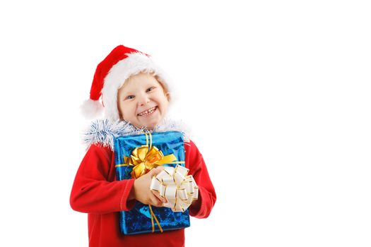 child dresssed as Santa with Christmas presents