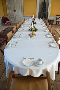 Traditional classical style conference meeting room in a hotel wirh a long table