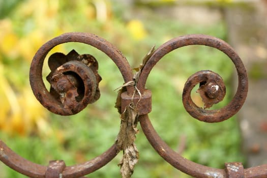 detail of an old rusted cast iron fence