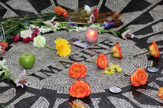 NEW YORK, USA - 9 OCTOBER: Admirers recollect John Lennon in his 72-nd birthday in Central Park, Strawberry Fields 9 october 2012, New York