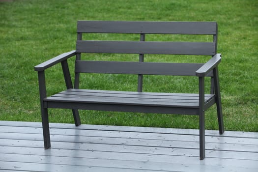 black wooden bench on green grass