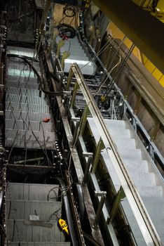 Installation of a new escalator during renovation works in a metropolitan railway station using heavy machinery