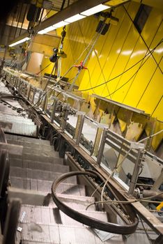 Installation of a new escalator during renovation works in a metropolitan railway station using heavy machinery
