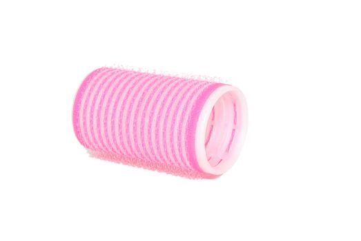 One velcro roller lying on its side, isolated on a white background