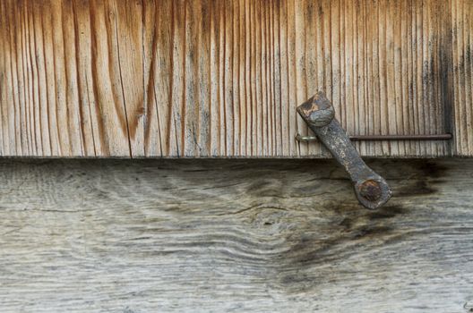 detail of wooden window shutter on old house