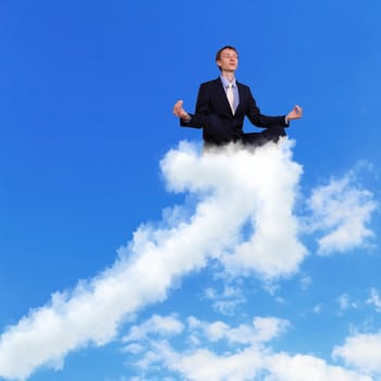 Businessman meditating sitting on the white cloud