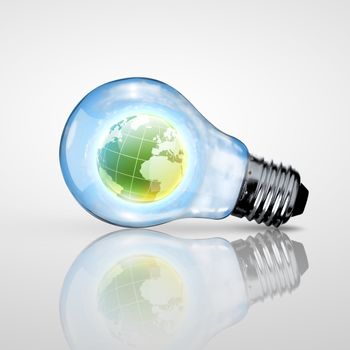 Electric light bulb and our planet inside it as symbol of green energy