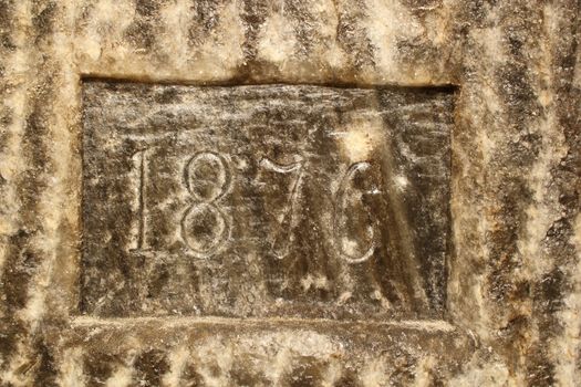 year 1876 carved in salt on a salt mine wall, as the exploitation reached that level; as you climb down the stairs, you reach different levels marked on wall