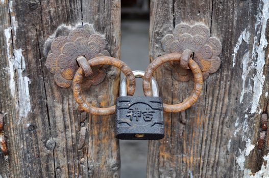 Iron doorknob or knockers on an old gate
