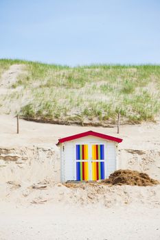 Colorfull Dutch house on the beach with blue sky. Texel, Holland