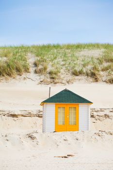 Colorfull Dutch house on the beach with blue sky. Texel, Holland